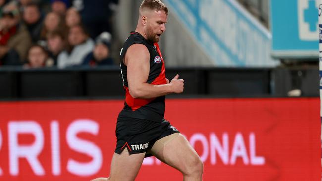 GEELONG, AUSTRALIA – JULY 15: Jake Stringer of the Bombers kicks a goal during the round 18 AFL match between Geelong Cats and Essendon Bombers at GMHBA Stadium, on July 15, 2023, in Geelong, Australia. (Photo by Kelly Defina/Getty Images)