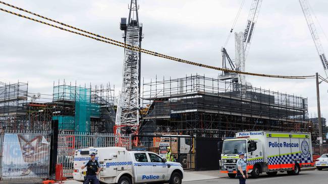 A crane collapsed at the construction site of the Sydney Fish Markets. Pic shows police directing traffic and the collapsed crane. Picture: NCA NewsWire / Max Mason-Hubers