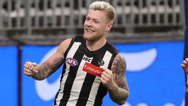 Jordan De Goey celebrates after scoring one of five goals against Geelong