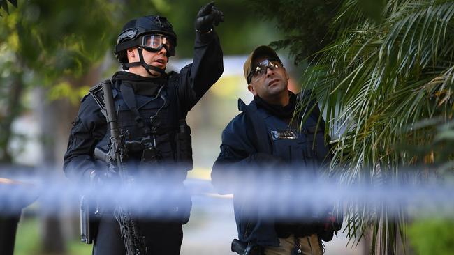 Special operations group police are seen responding to a reported stabbing in St Kilda. Picture: AAP