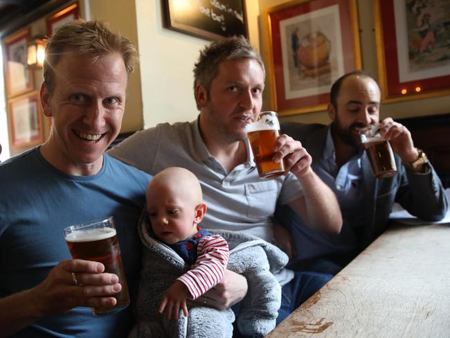 Rob Foster and son Riley, 10 months, of Datchet, Carl Dawson of Windsor and Wayne Clements, of Windsor, give the Windsor Knot the taste test at the George pub. Picture: Ella Pellegrini/ News Corp Australia