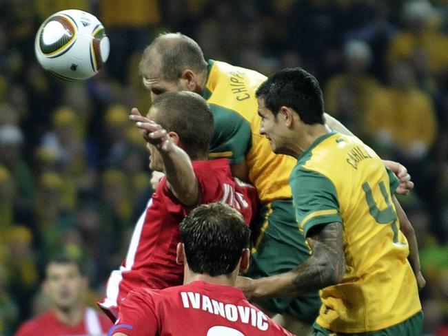 Tim Cahill (right) climbs high to score against Serbia at the 2010 World Cup in South Africa. Picture: AP