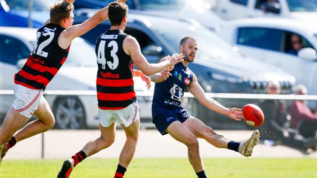 Launceston Football Club's Jay Blackberry curls a kick around Lauderdale players. Picture: PATRICK GEE