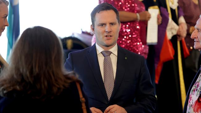 Minister for Immigration and Citizenship Alex Hawke (C) takes part in the swearing in of new citizens in Parramatta on Australia Day. Picture: Toby Zerna