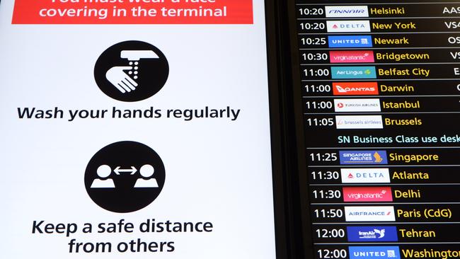 A departures board at Heathrow Airport shows a Qantas flight from London to Darwin. Picture: Annabel Moeller