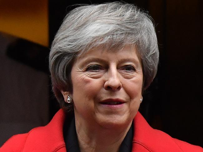 Britain's Prime Minister Theresa May leaves 10 Downing Street in London on December 5, 2018 to attend Prime Ministers questions in Parliament. - British Prime Minister Theresa May returns to the House of Commons today after a series of stunning defeats by MPs that threaten her government and could change the course of Brexit. (Photo by Ben STANSALL / AFP)