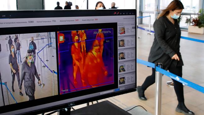 A machine scans the body temperature of people at Ben Gurion Airport in Israel this month. Picture: AFP