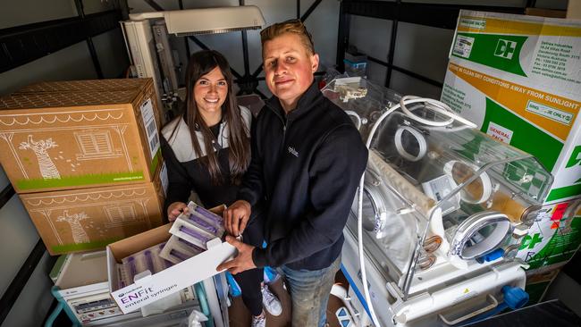 Ainslie Casbolt, an opblue medical volunteer and opblue managing director Jack Wilson in a shipping container filled with medical supplies destined for Africa at Jack's Lenswood property. Picture: Tom Huntley