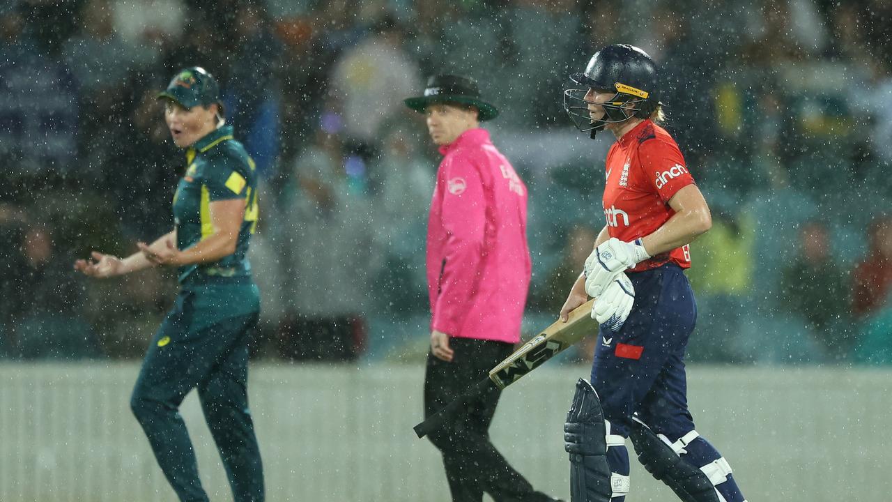 Grace Harris of Australia reacts as Heather Knight reluctantly comes of the field with 5 balls remaining due to rain. (Photo by Mark Metcalfe/Getty Images)