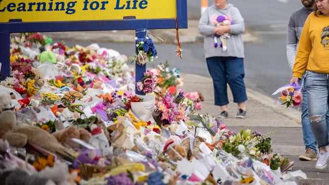 The large collection of flowers, cards and bears placed in tribute to the victims of the jumping castle tragedy at Hillcrest Primary School. Picture: Jason Edwards