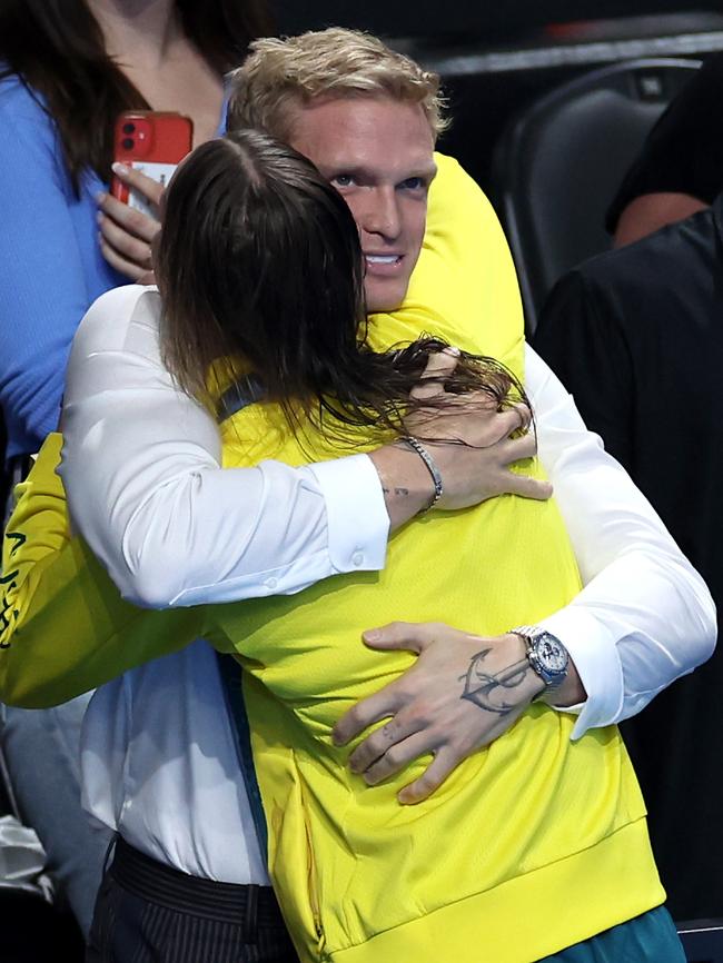 Recently retired Cody Simpson helps partner Emma McKeon celebrate winning gold in Paris. Picture: Quinn Rooney/Getty Images