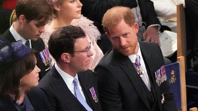 Britain's Princess Eugenie of York, Jack Brooksbank and Britain's Prince Harry, Duke of Sussex attend the coronation ceremony of King Charles III and Queen Camilla. Picture: AFP