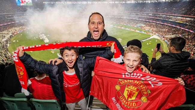 Greg Chelser with his sons Leo and Jake enjoying the atmosphere at the MCG. Picture: Jason Edwards