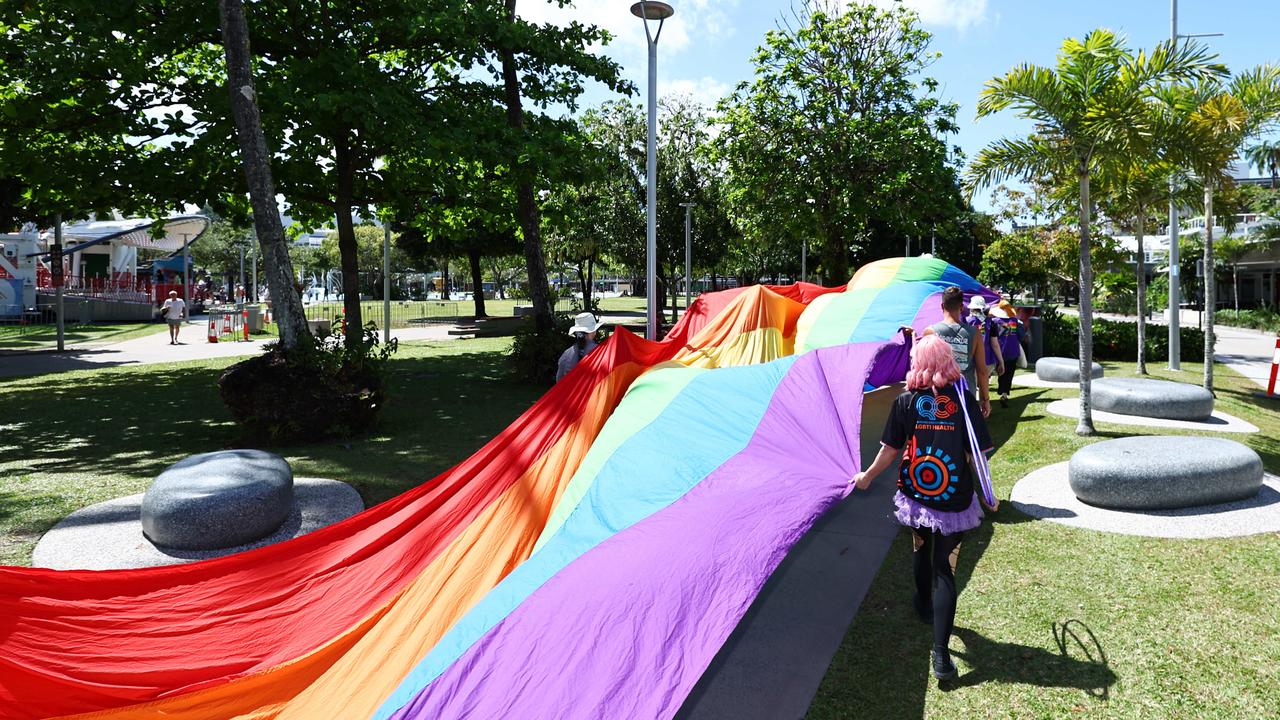 A group of LGBTIQA+SB people and supporters paraded along the Cairns Esplanade with a huge rainbow flag for the Pride Stride, part of the Cairns Pride Festival. Picture: Brendan Radke