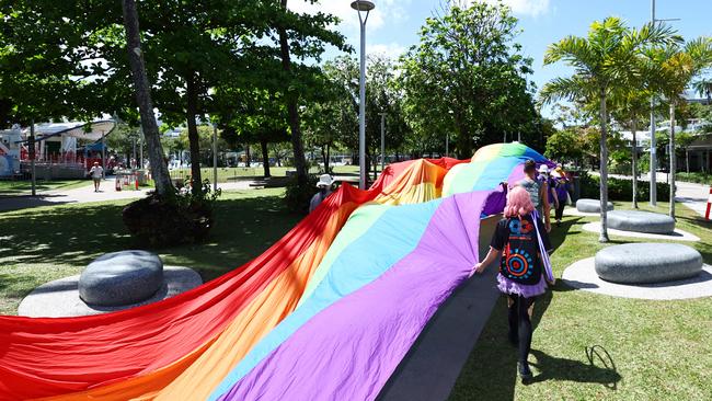 A group of LGBTIQA+SB people and supporters paraded along the Cairns Esplanade with a huge rainbow flag for the Pride Stride, part of the Cairns Pride Festival. Picture: Brendan Radke