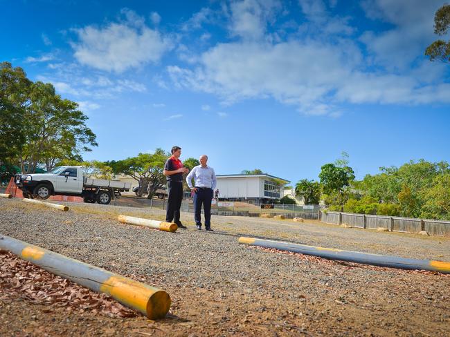 Principle Michael Hurst and member for Gladstone Glenn Butcher discuss funding to upgrade the "unofficial" carpark at Boyne Island State School.