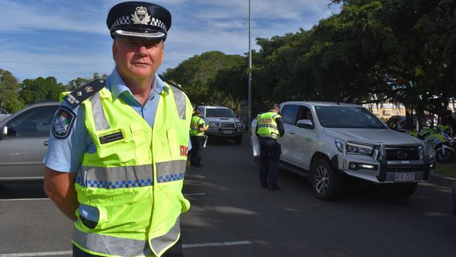 OPERATION SLEDGE HAMMER: Superintendent Michael Sawrey with the operation taking place behind him. Photo: Stuart Fast