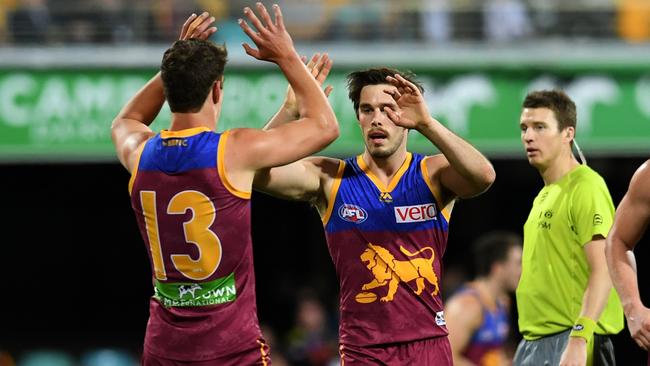 Jarrod Berry and Ryan Bastinac celebrate a goal against the Bulldogs.