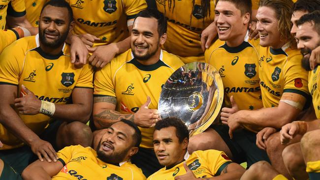 Wallabies players celebrate their win over Wales at Millennium Stadium.
