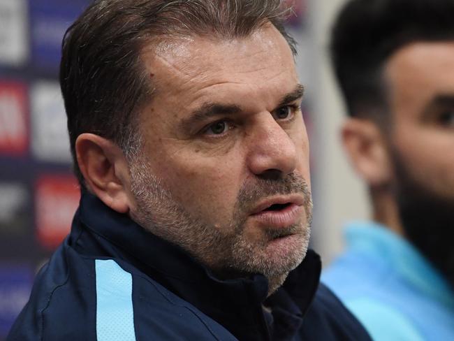 Australia football team head coach Ange Postecoglou (left) speaks as he sits next to team captain Mile Jedinak during a press conference at Stadium Australia in Sydney, Tuesday, November 14, 2017. The Australia 'Socceroos' play Honduras on Wednesday night in a second leg Russia 2018 World Cup playoff football match. (AAP Image/David Moir) NO ARCHIVING