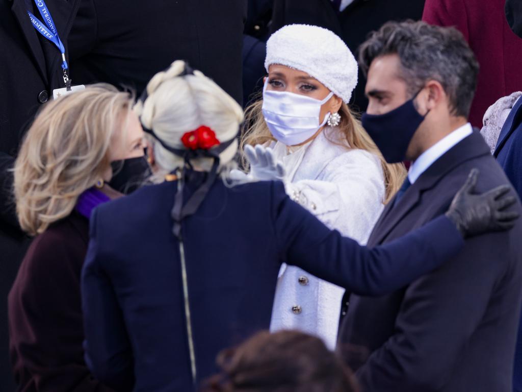 Former Secretary of State Hillary Clinton greets Lady Gaga and Jennifer Lopez. Picture: Alex Wong/Getty Images