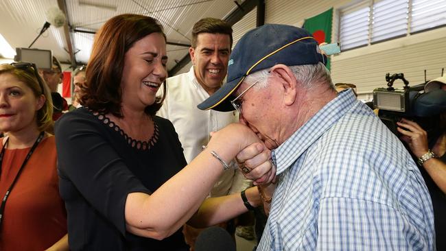 Annastacia Palaszczuk is greeted by a voter at Inala State School where she cast her vote at the 2015 election. Picture: Adam Head