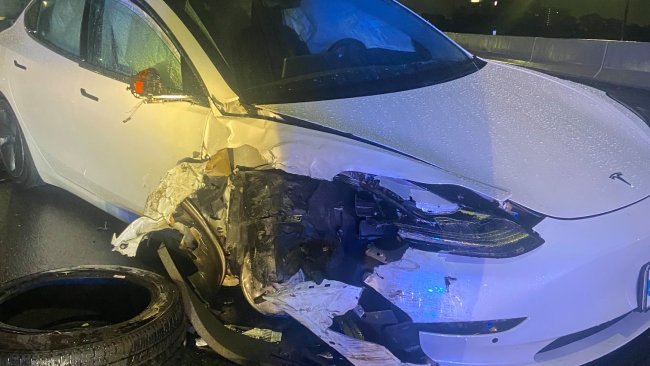 The 27-year-old Tesla driver and the disabled car's driver both received minor injuries while the police officer was uninjured. Picture: Twitter/ FHP Orlando