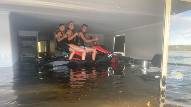 Siblings Ryda , Georgia and Jai Bunker on their jetski inside their upstairs room in their shack on Old Murbko road, Beaumonts. Dec 26th 2022. Picture: Courtney Bunker