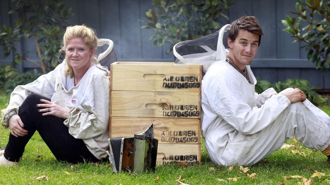 Antonia O'Brien has accepted a redundancy from the Health Department and is going to focus her efforts on the honey business she runs with her husband Robin, on the right,