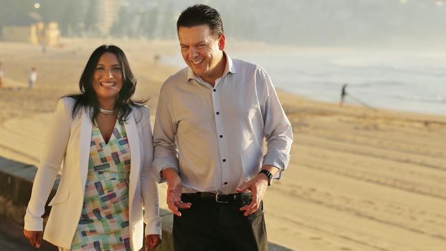 Senator Xenophon talks to local candidate Marie Rowland along the beachfront at Manly. Picture: Braden Fastier