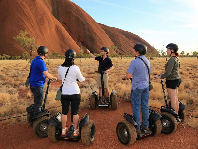 I lean forward, and the stark red desert rushes to meet me. The patchwork quilt of spinifex grass, mulga trees and iron-rich red dirt breeze by at 10km/h as I orbit Australia’s heart of stone. The Segway’s speed does nothing to diminish the enormity and mystery of Uluru. In fact, the up-close view gives me a greater appreciation of the Red Centre’s centre, from its pre-prehistoric shell to the partially exposed hints of the network of tunnels within. It’s almost like a giant brain in the middle of the desert. It certainly makes you stop and think.