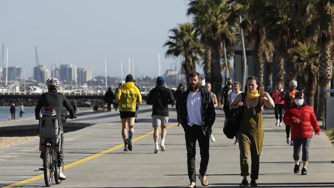 People enjoy exercise at St Kilda Beach in Melbourne on Saturday. Picture: NCA NewsWire / Daniel Pockett