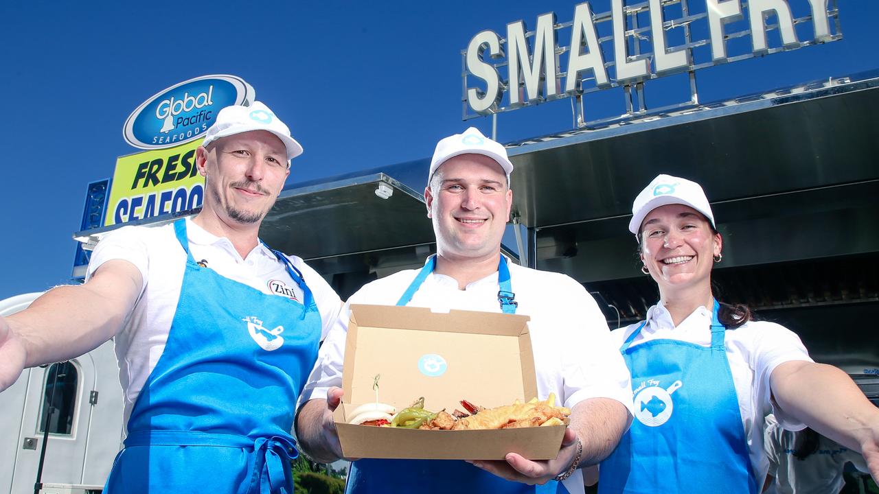 Small Fry Robina owner and head chef with chef Samuel Cahill (L) and sister Georgina , Braden Ceccato said it was a "crazy feeling" to have won the Bulletin's best fish and chips restaurant on the Gold Coast. Picture: Glenn Campbell