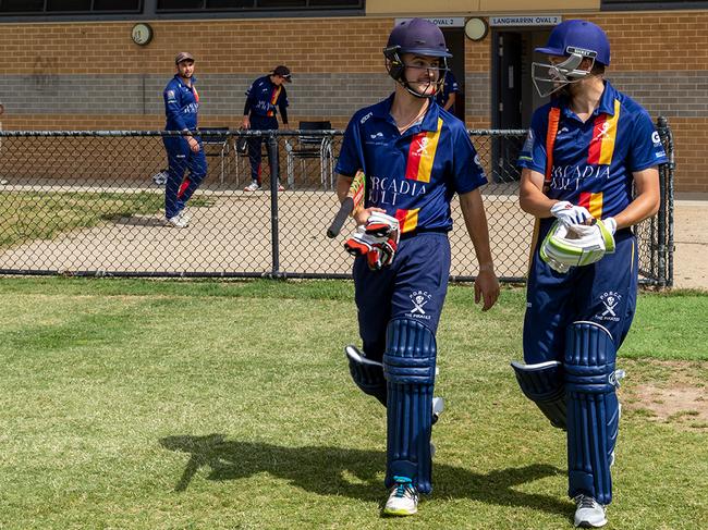 Old Peninsula openers Will La Broy (left) and Tom Humphris walk out to the middle. Picture: Anthony Pearce