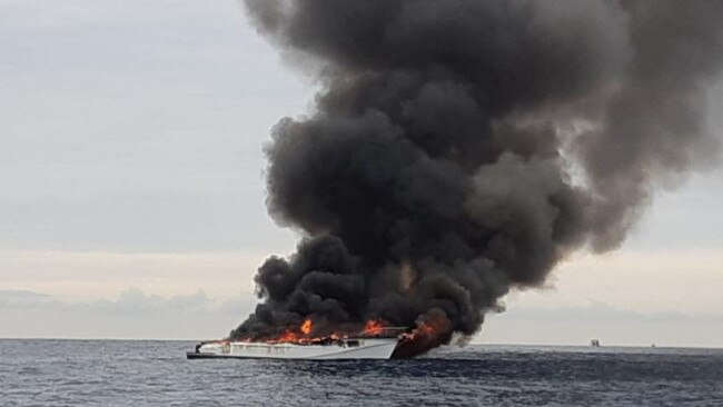 The boat was quickly engulfed in flames after the fire broke out about 8am. Picture: Queensland Ambulance Service.