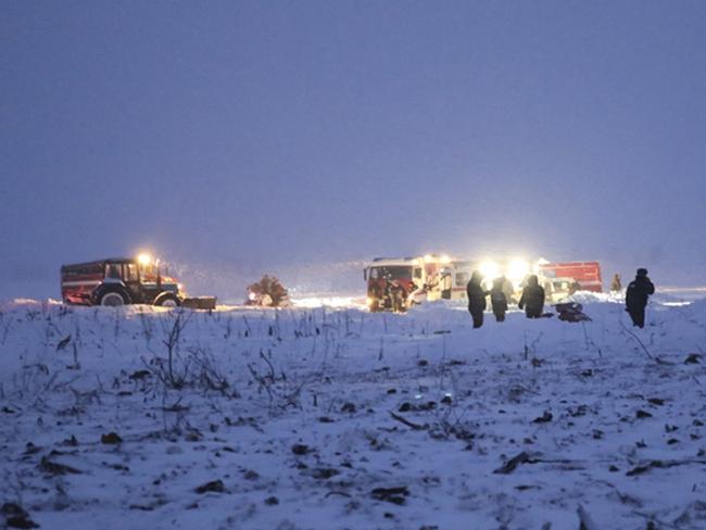 Russian Ministry for Emergency Situations employees work at the scene of a AN-148 plane crash about 40 kilometres from the Domodedovo airport. Picture: AP