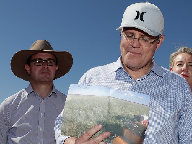 Scott Morrison on a tour of the Queensland bush in his cap, rather than an Akubra. Picture: Alex Ellinghausen