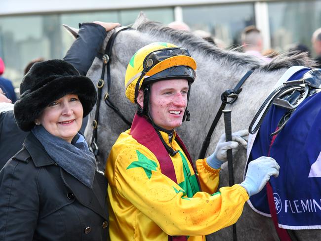 MELBOURNE, AUSTRALIA - MAY 15: Wendy Kelly poses with Michael Poy after Cakewalk Baby won Race 2, the Goodwood Trophy, during Melbourne Racing at Flemington Racecourse on May 15, 2021 in Melbourne, Australia. (Photo by Vince Caligiuri/Getty Images)