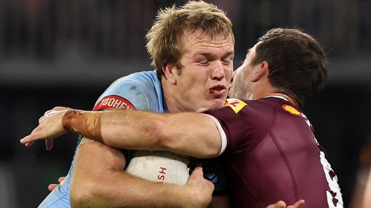 PERTH, AUSTRALIA - JUNE 26: Jake Trbojevic of the Blues is tackled by mduring game two of the State of Origin series between New South Wales Blues and Queensland Maroons at Optus Stadium on June 26, 2022 in Perth, Australia. (Photo by Paul Kane/Getty Images)