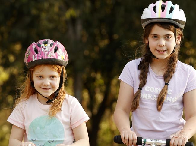 Celia Jelley, 6, (left) and her sister Millie, 9, are looking forward to seeing their friends again Picture: Jonathan Ng