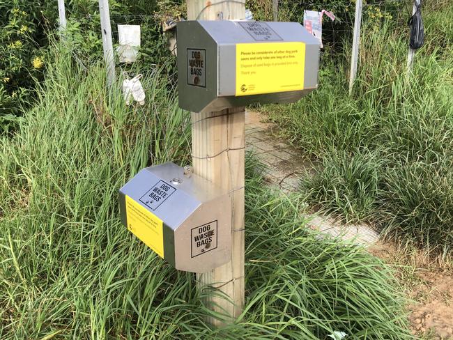 Free dog waste bag dispensers provided by Northern Beaches Council, like this one at North Curl Curl off-leash dog park, could be replaced by vending machines where dog owners would have to pay for poo collection bags. Picture: Jim O’Rourke