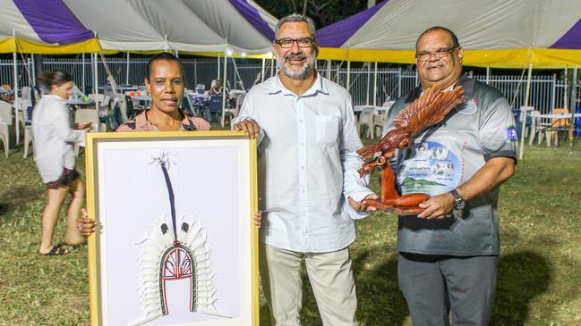 The transition of native title service delivery was marked in ceremony on June 29, 2022. TSRA board members Danie Savage and John Paiwan present artwork to GBK Chairman Lui Ned David (middle) to commemorate the new era. Photo: supplied.