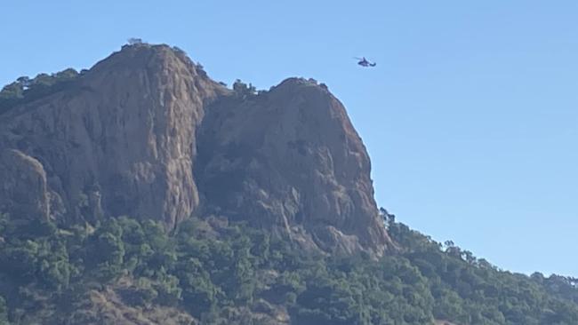 There are grave fears for the life of a person who has fallen from the lookout at Castle Hill in Townsville. The Polair Townsville helicopter and Queensland Government Air (QGAir), pictured, has also been deployed. Picture: Tony Tsimbas