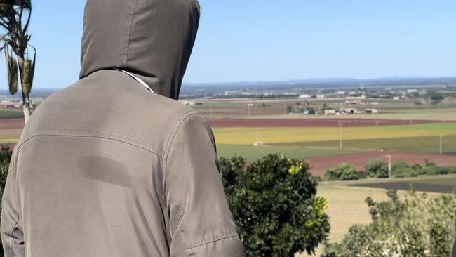 Ni'Vanuatu worker Alan overlooks Bundaberg from The Hummock. Alan said he had been treated badly by a farmer and contractor and had seen people "run away" from Bundaberg.