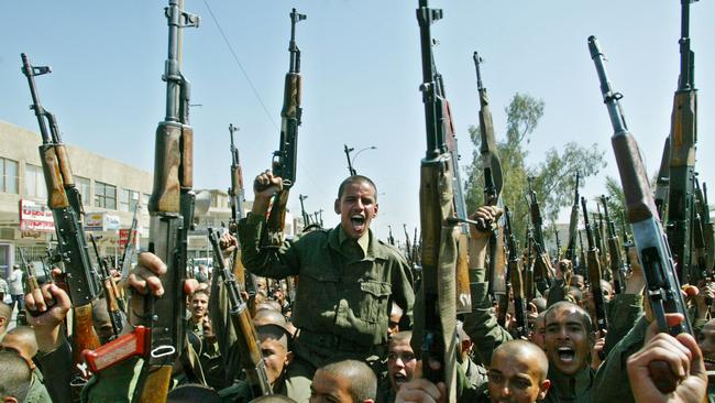 Iraqi soldiers during a demonstration to show support for Saddam Hussein.