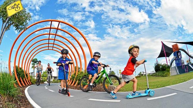 ON A ROLL: Out enjoying Pedal Park at Aura are Freddy, 3, (red top), Quinn, 6 (scooter), Donna Odell (mum black top), with Alex and Layklan Selkrig, 5 (green bike). Picture: Patrick Woods