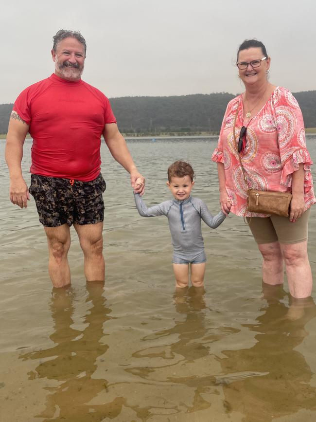 Karen and Michael Bailey with their grandson Niklaus at Penrith Beach