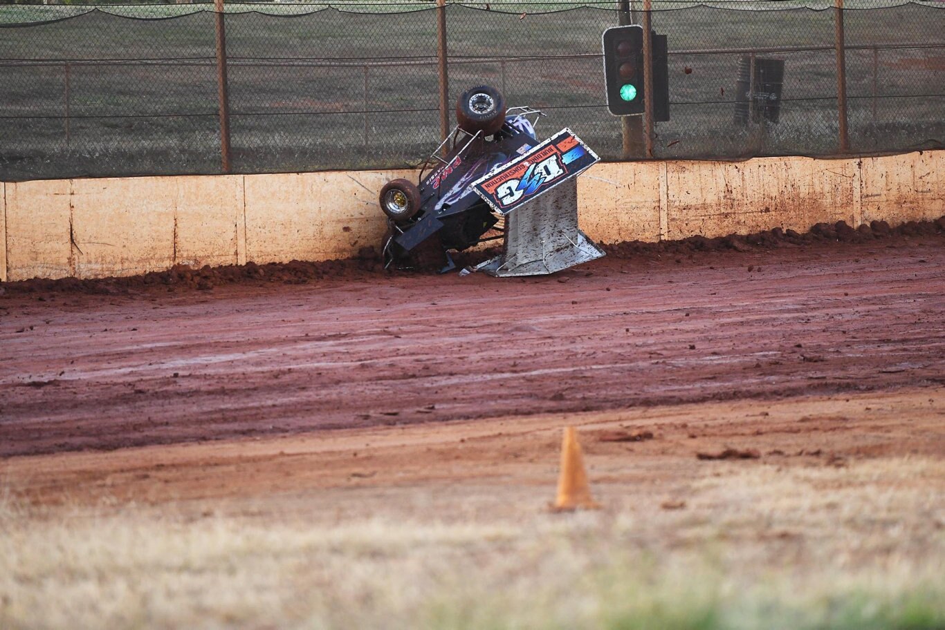 Maryborough Speedway Round One - Ken Newton climbs the wall after losing control on the slippery track. Picture: Cody Fox