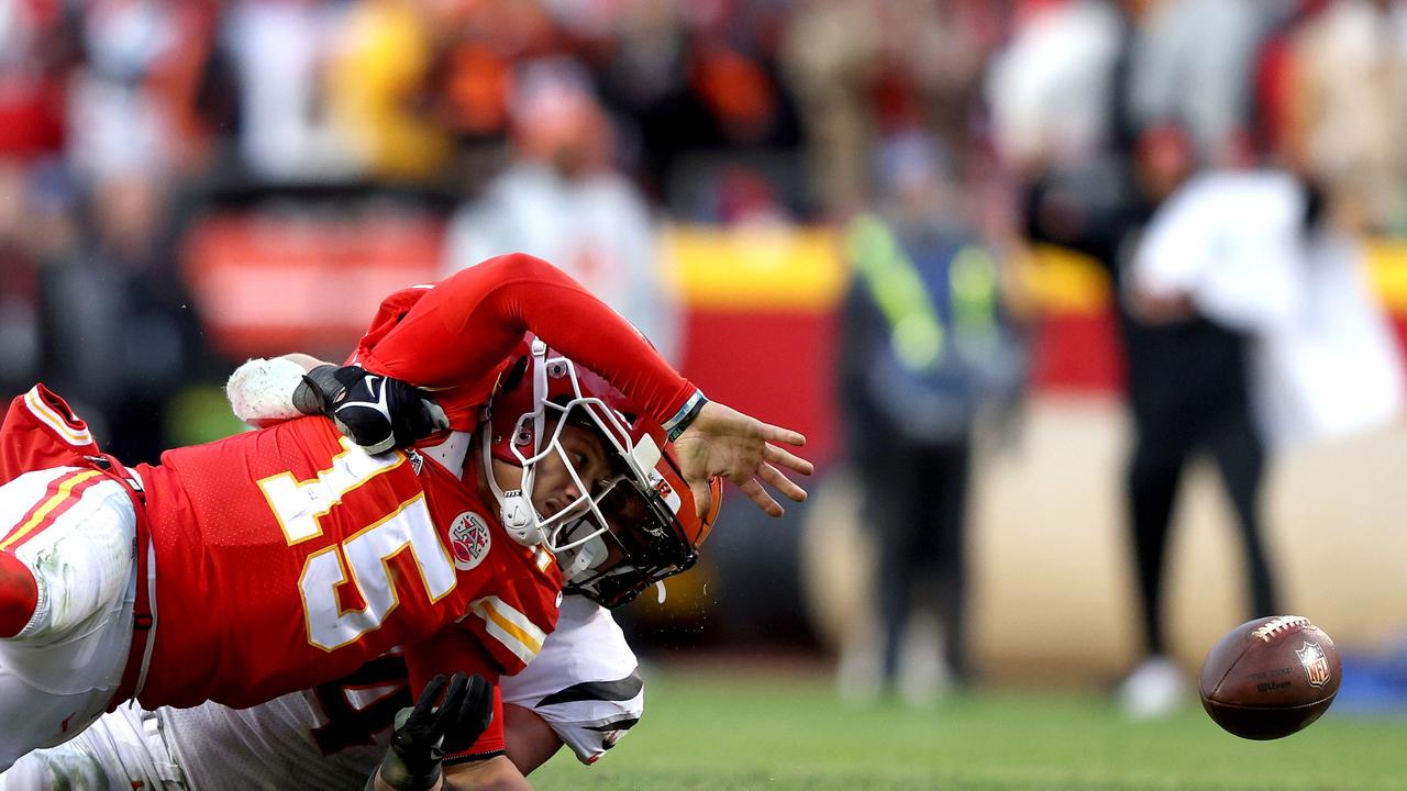 Cincinnati Bengals long snapper Clark Harris tosses a football to a fan  before the AFC championship NFL football game against the Kansas City Chiefs,  Sunday, Jan. 30, 2022, in Kansas City, Mo. (