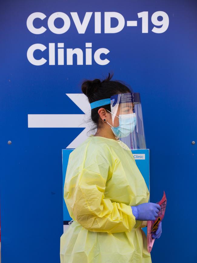 A nurse is seen with a Covid-19 test kit walking through the pop-up clinic at RPA in Sydney Australia. Picture: NCA NewsWire / Gaye Gerard